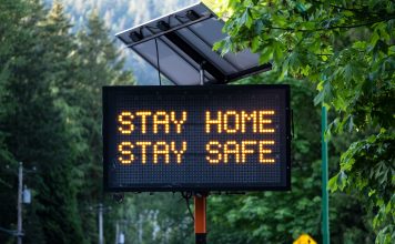 23,000 Covid deaths could have been avoided if lockdown started earlier Solar Powered Stay Home Stay Safe Road Sign