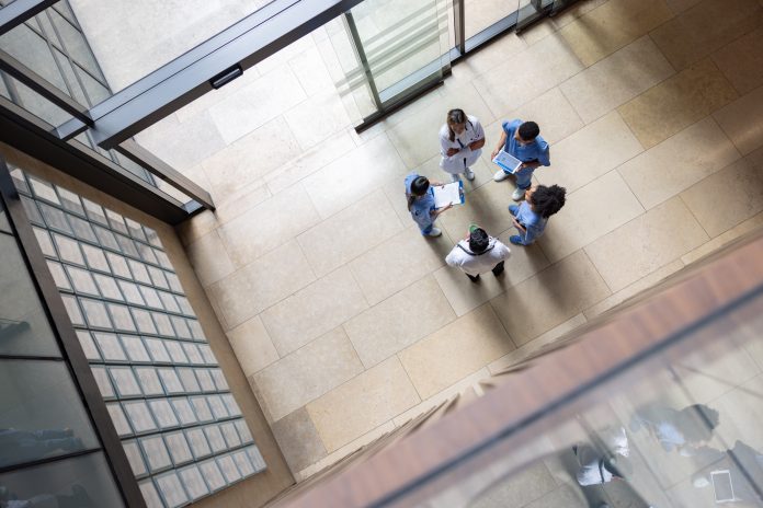 Group of doctors talking in a casual meeting at the hospital