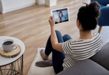 Young woman having a video conference with her doctor