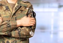 UK awards £2.5m contract to transform deployed military healthcare military doctor with crossed arms at a hospital