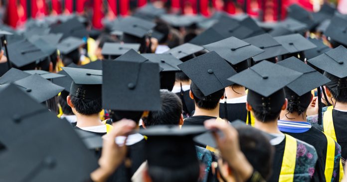 Back view of graduates during commencement.