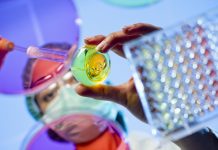 Technician at a laboratory surrounded by lab tools