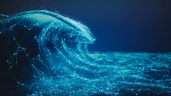 Abstract Digital Wave Technology Background Visualization of an ocean wave created with glowing network nodes and lines on a deep blue background.