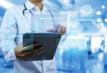 Electronic medical record system EMR medical technology concept with doctor using tablet to records patient information and personal health history