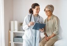 Female patient listening to a doctor in hospital.