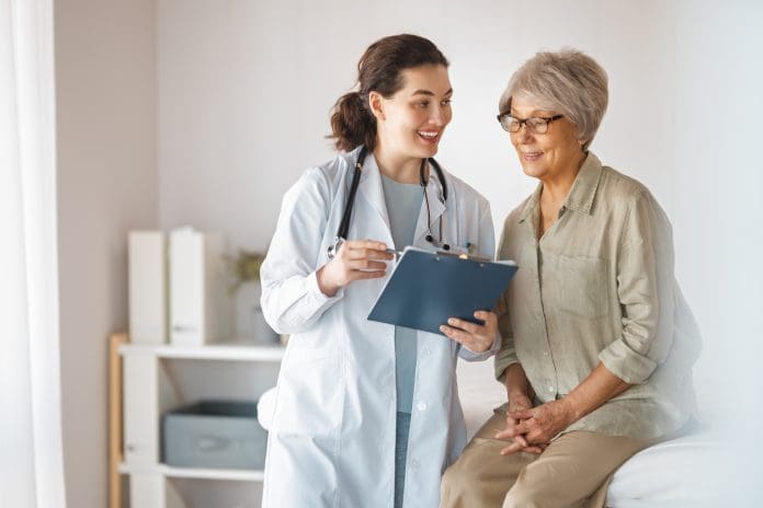 Female patient listening to a doctor in hospital.
