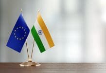 EU and India begin talks on Horizon Europe association European Union And Indian Flag Pair On A Desk Over Defocused Background
